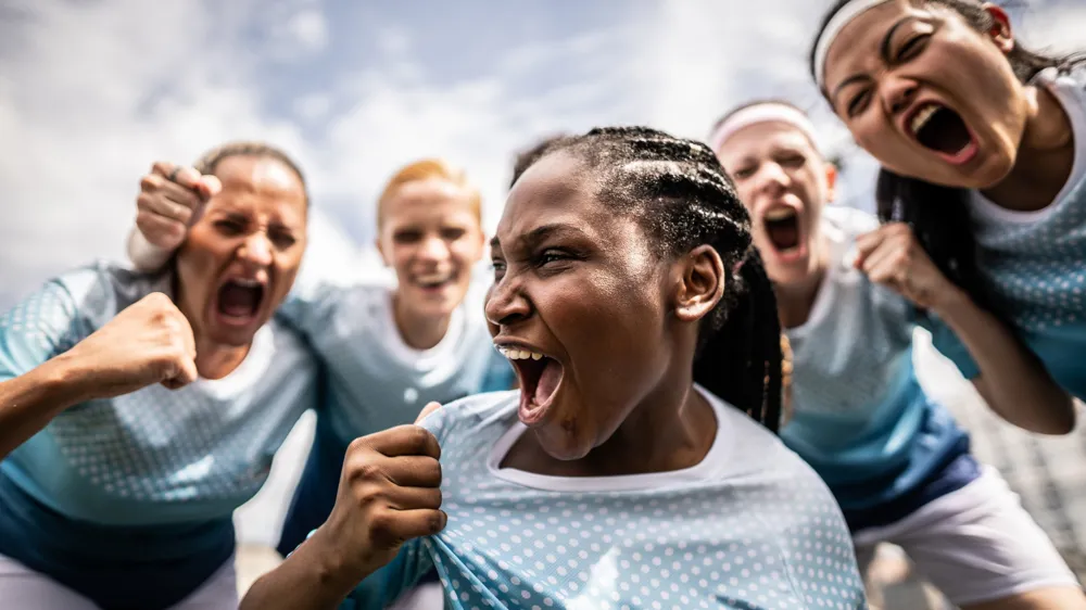  female soccer team celebrating