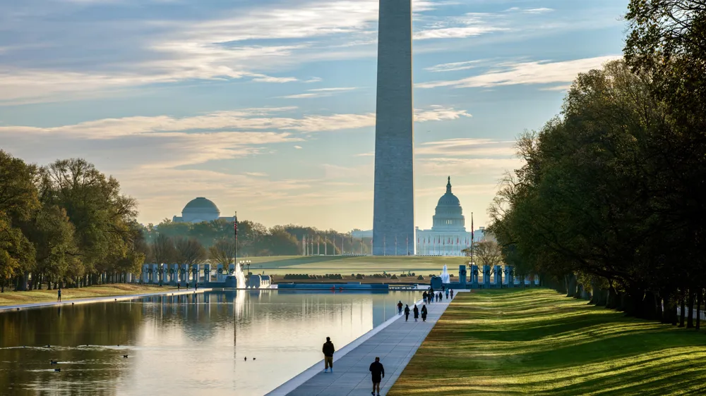 Alt Text: Vibrant sunrise over the National Mall in Washington DC