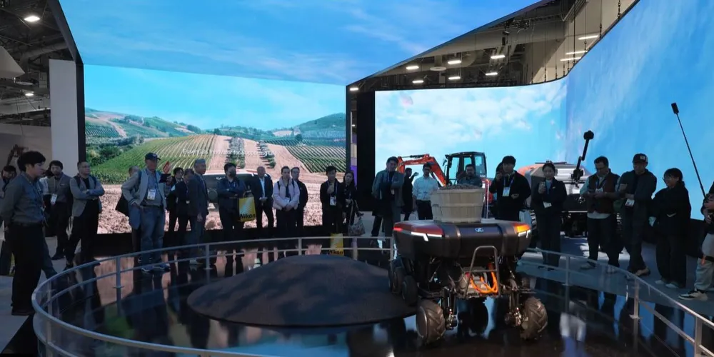 ALT Text: a big display with people surrounding  